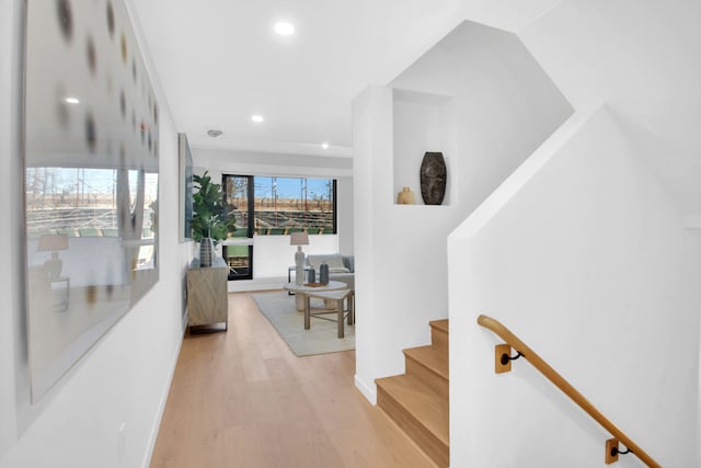 24 Huntington St, New York City, NY 11231 - hall with recessed lighting, light wood finished floors, and stairway