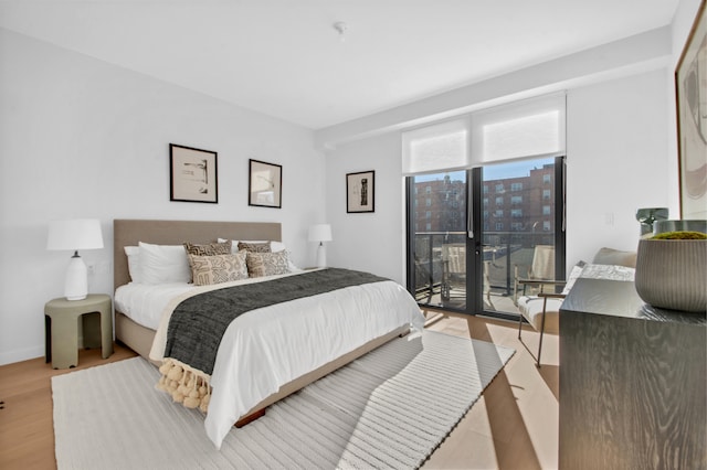 24 Huntington St, New York City, NY 11231 - bedroom featuring light wood-type flooring and access to exterior