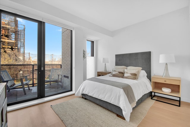 24 Huntington St, New York City, NY 11231 - bedroom with wood finished floors and access to outside