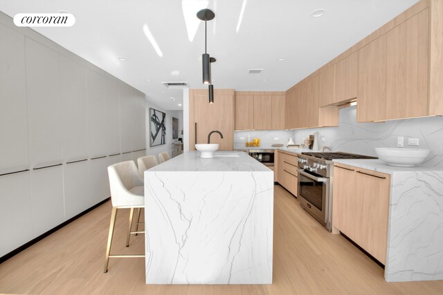 24 Huntington St, New York City, NY 11231 - kitchen featuring stainless steel appliances, modern cabinets, and light brown cabinets