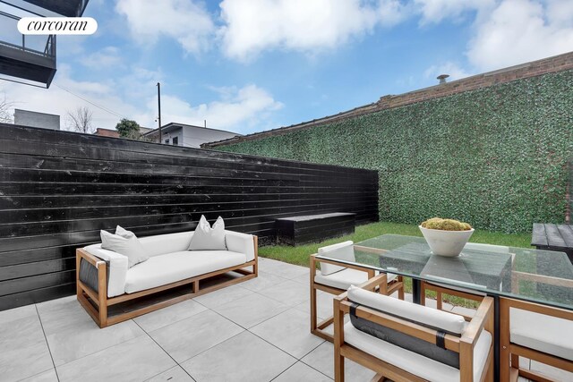 24 Huntington St, New York City, NY 11231 - fenced backyard featuring outdoor dining space and a patio