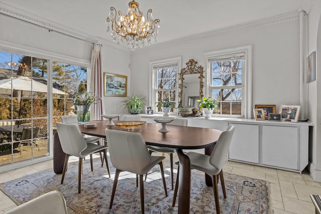 dining space featuring crown molding, light tile patterned flooring, and a chandelier