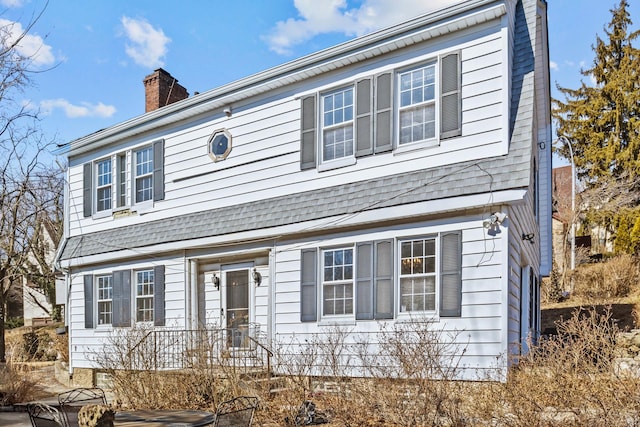 view of front of house with a chimney