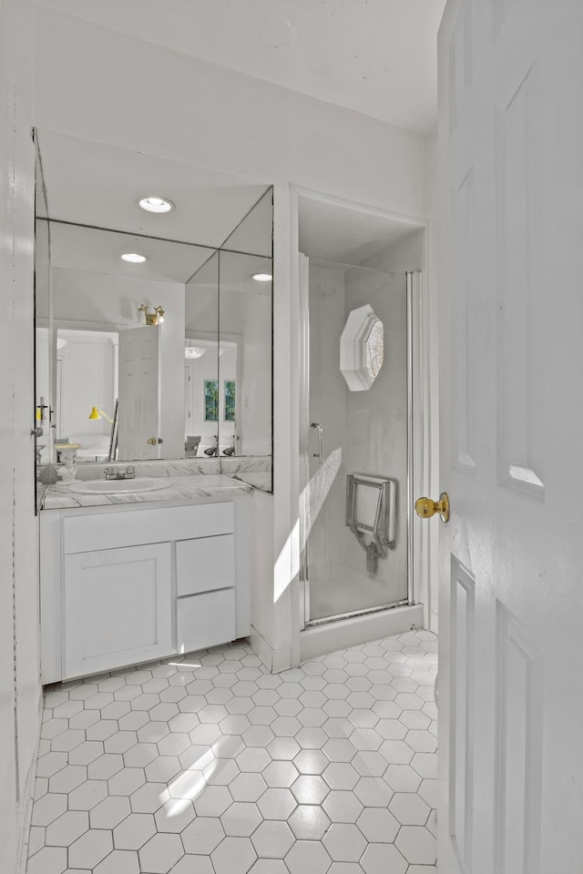 bathroom featuring vanity, a stall shower, and tile patterned flooring