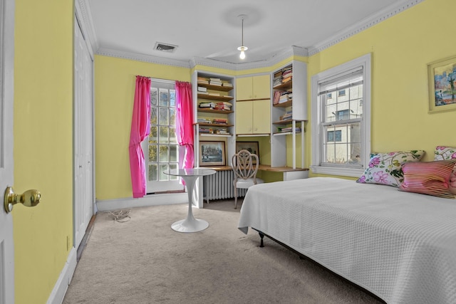 carpeted bedroom with visible vents, radiator heating unit, baseboards, and ornamental molding