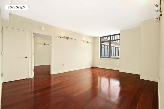 1485 5th Ave Unit 16E, New York City, NY 10035 - empty room with visible vents, baseboards, and wood finished floors