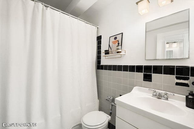 full bathroom with toilet, a shower with shower curtain, tile walls, and vanity