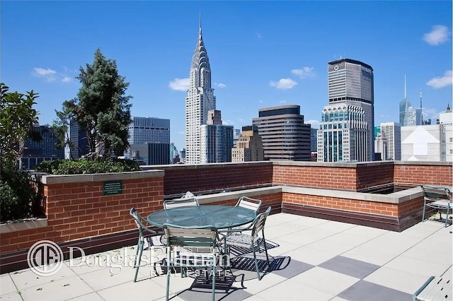 view of patio with a city view