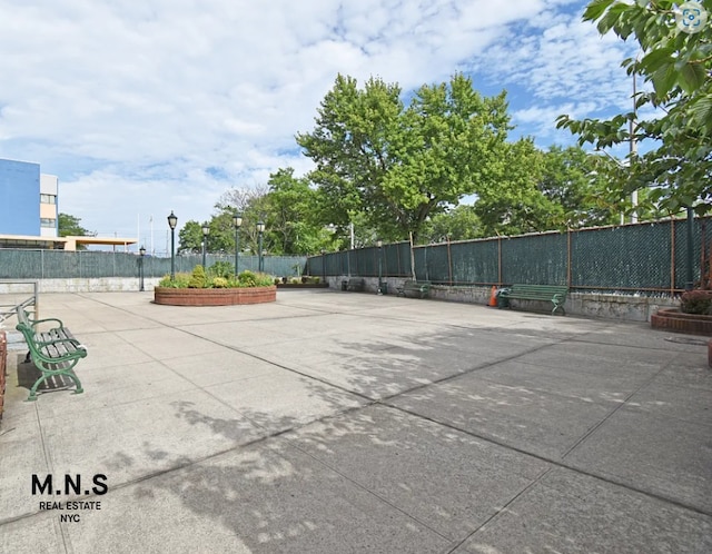 view of sport court with fence