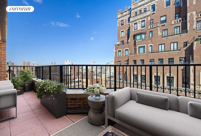 balcony featuring a view of city and outdoor lounge area