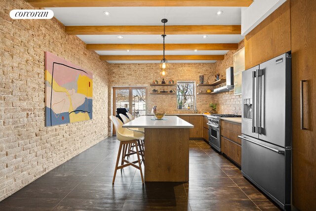 kitchen featuring wall chimney exhaust hood, high quality appliances, brown cabinets, light countertops, and open shelves