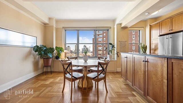 dining area featuring baseboards