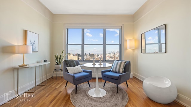 sitting room featuring light wood-style floors and baseboards