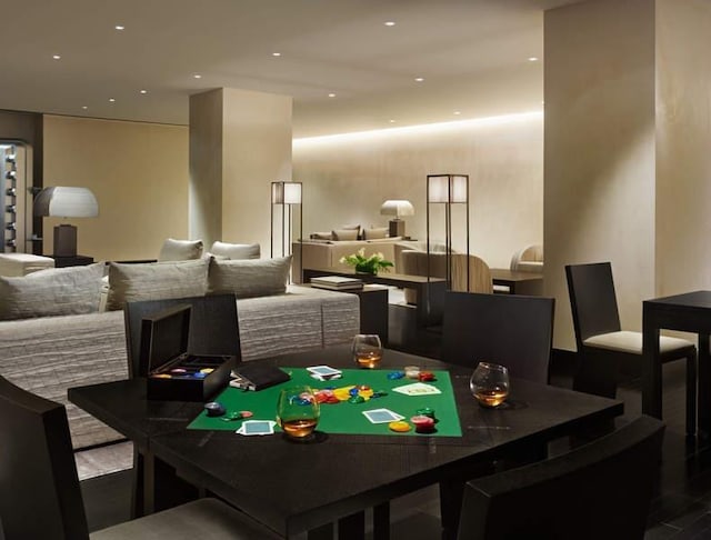 dining area with recessed lighting and wood finished floors