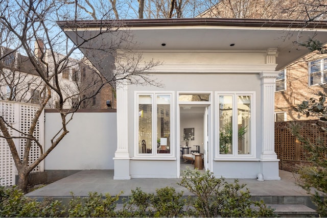 property entrance featuring stucco siding