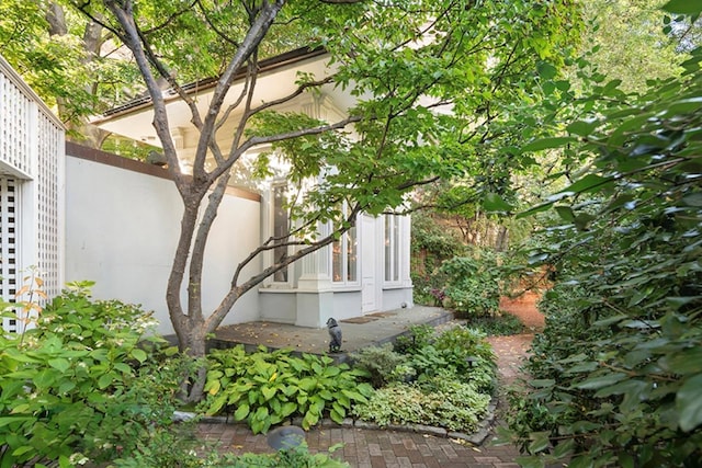 view of side of home with fence