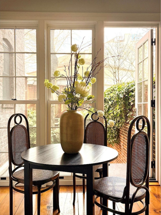 dining space featuring light wood-style floors