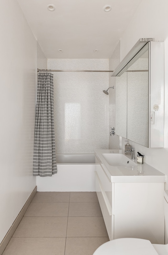 full bath with shower / tub combo, tile patterned flooring, vanity, and toilet