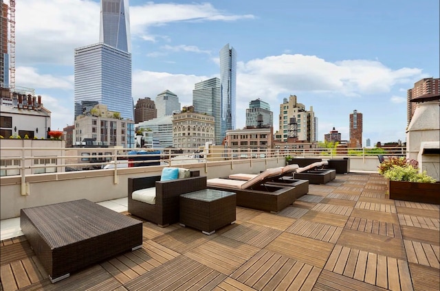 exterior space featuring an outdoor hangout area and a city view