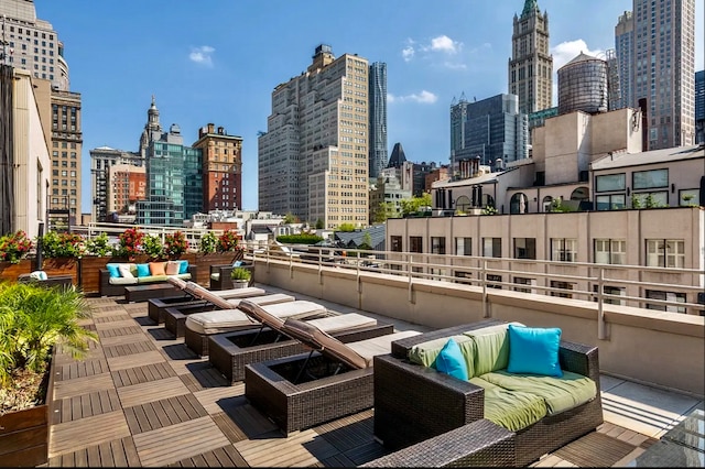 view of patio / terrace with an outdoor living space and a city view
