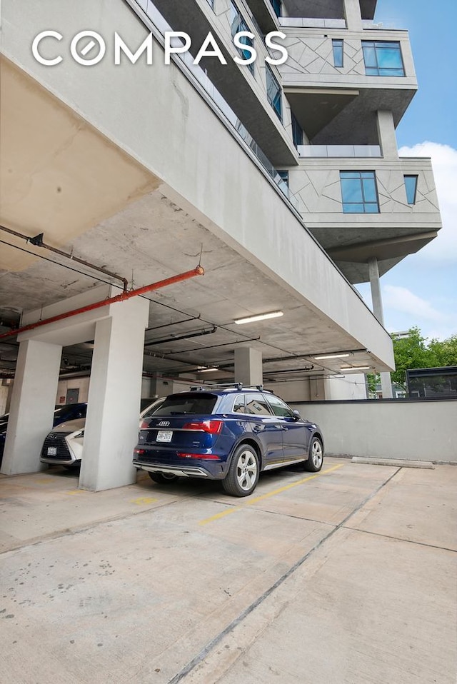 view of parking featuring a parking deck