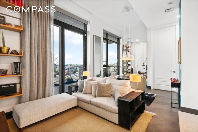 living room with visible vents and recessed lighting