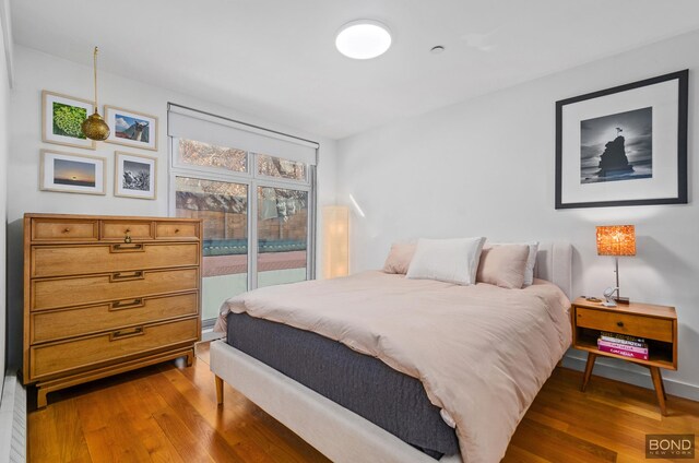 bedroom with wood finished floors