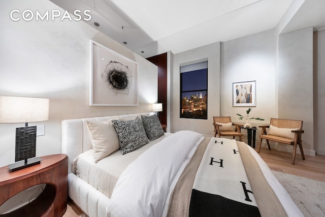 bedroom with light wood-style floors