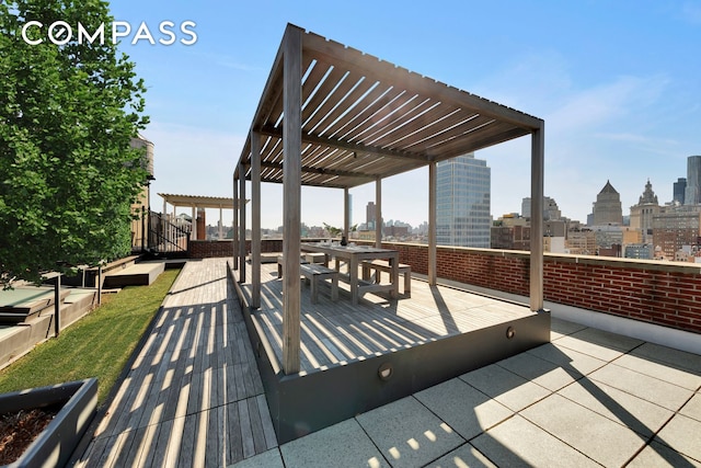 view of patio / terrace featuring a city view and a pergola