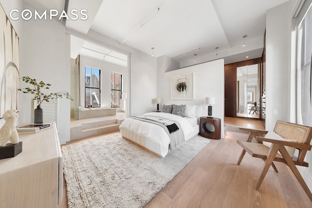 bedroom with light wood-style floors