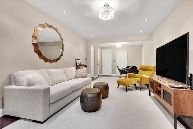 carpeted living room featuring recessed lighting and baseboards