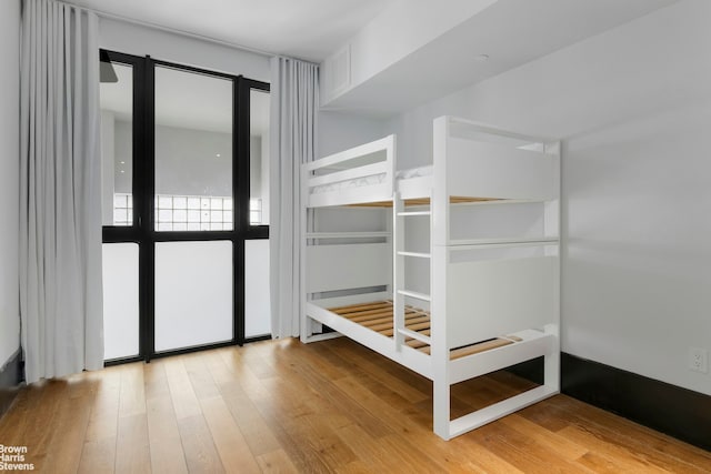 unfurnished bedroom with wood finished floors