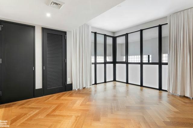 spare room with recessed lighting and visible vents