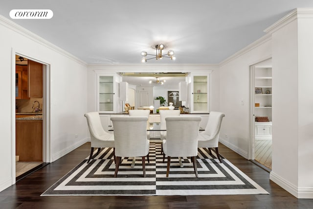 dining area featuring a notable chandelier, visible vents, dark wood finished floors, and crown molding