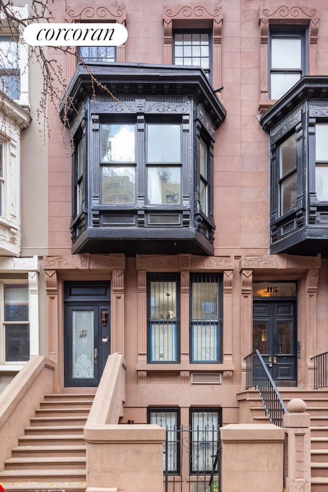 117 W 87th St, New York City, NY 10024 - view of front of home featuring a fenced front yard, stairs, and a gate