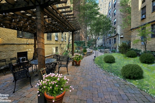 414 E 52nd St Unit 10E, New York City, NY 10022 - view of patio featuring a pergola