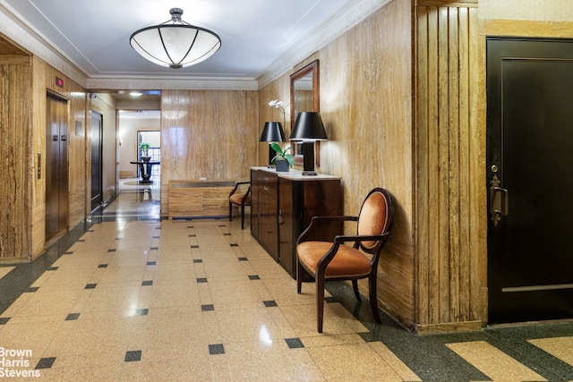 414 E 52nd St Unit 10E, New York City, NY 10022 - corridor with wood walls, crown molding, inlaid floor details, elevator, and granite tiled floors