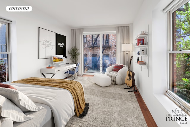 bedroom featuring visible vents and wood finished floors