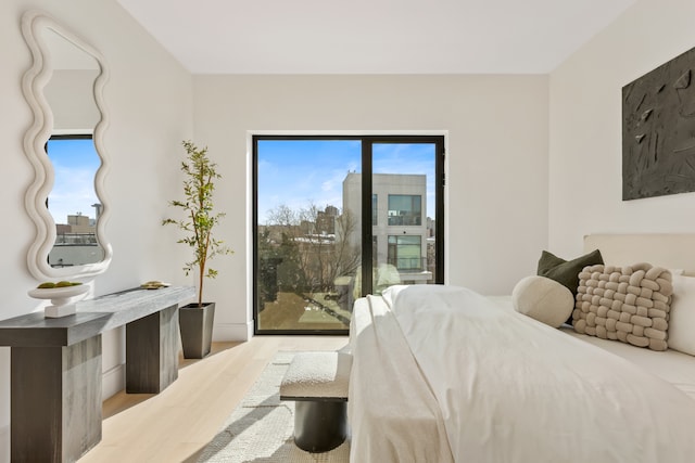 28 Herbert St Unit 4C, New York City, NY 11222 - bedroom featuring access to outside and wood finished floors