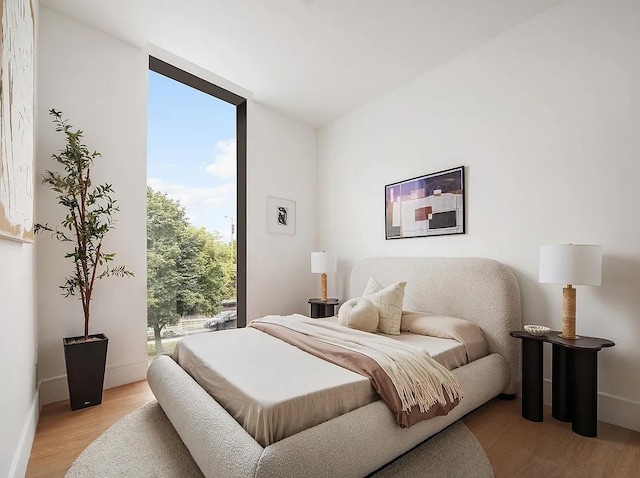 28 Herbert St Unit 4C, New York City, NY 11222 - bedroom featuring light wood-style flooring and baseboards