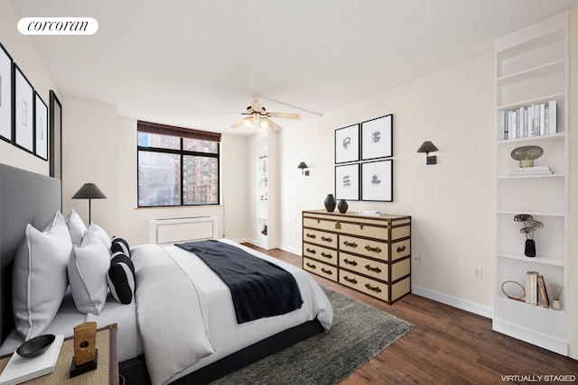 bedroom featuring visible vents, baseboards, wood finished floors, and a ceiling fan