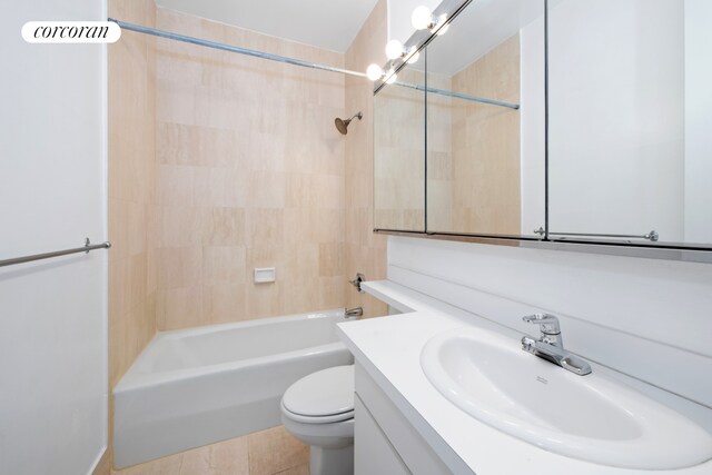 bathroom featuring tub / shower combination, toilet, and vanity