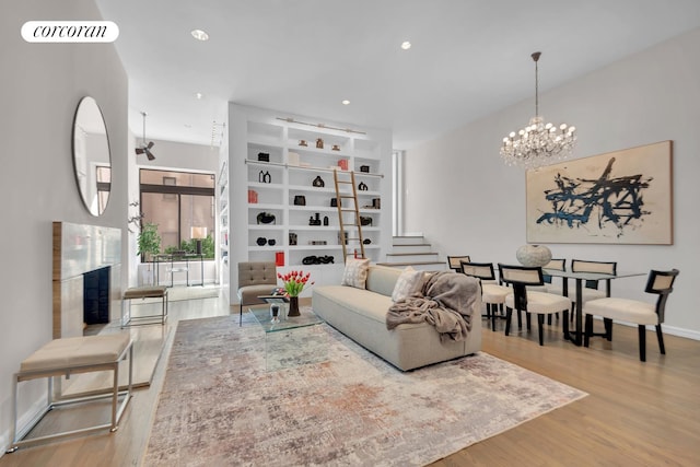 30 W 86th St Unit 2B, New York City, NY 10024 - living area with wood finished floors, a chandelier, stairway, baseboards, and recessed lighting
