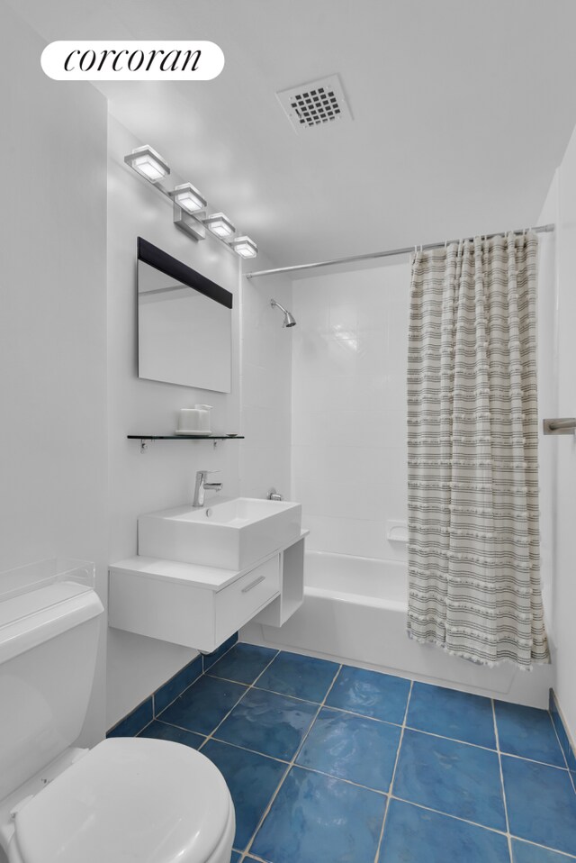 30 W 86th St Unit 2B, New York City, NY 10024 - full bathroom with toilet, shower / bath combo with shower curtain, a sink, and tile patterned flooring