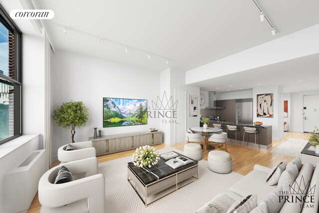 421 W 54th St Unit 4B, New York City, NY 10019 - living area with rail lighting and light wood-style flooring
