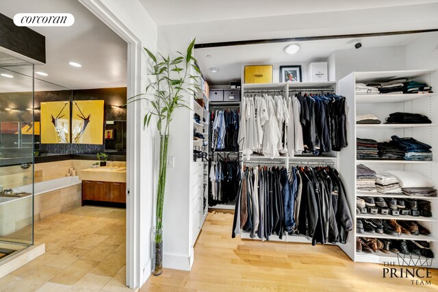 spacious closet with visible vents and wood finished floors