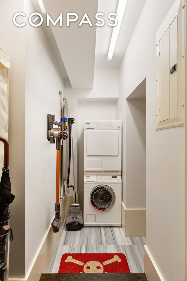 110 E 71st St Unit 3, New York City, NY 10021 - laundry room with estacked washer and dryer and electric panel
