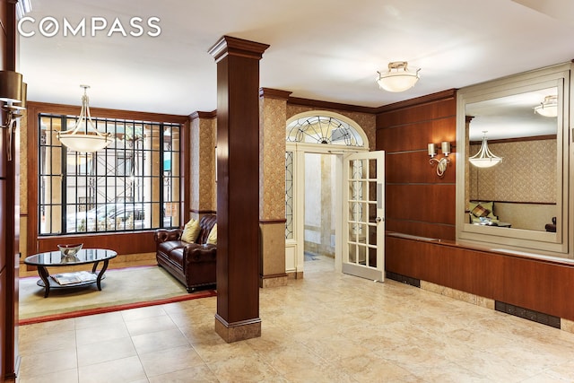 110 E 71st St Unit 3, New York City, NY 10021 - foyer entrance featuring wallpapered walls and decorative columns