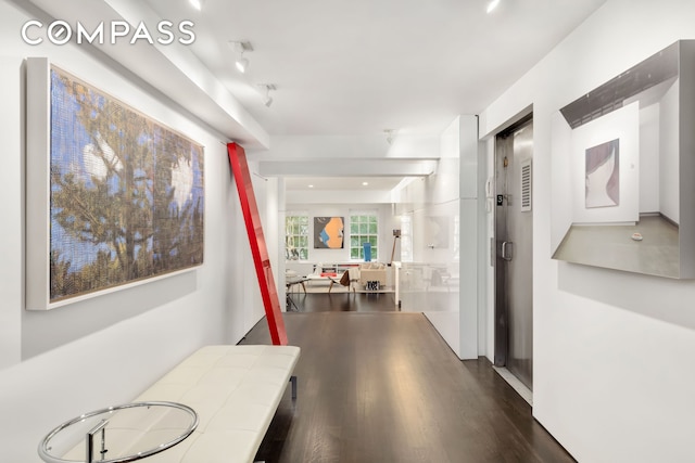 hallway with wood finished floors