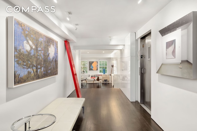 110 E 71st St Unit 3, New York City, NY 10021 - hallway featuring dark wood-style flooring